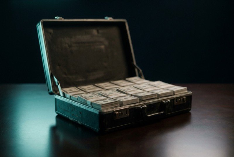 An open briefcase full of banknotes